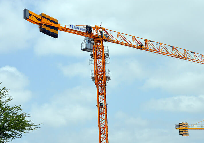 Potain top slewing tower crane model at a construction site